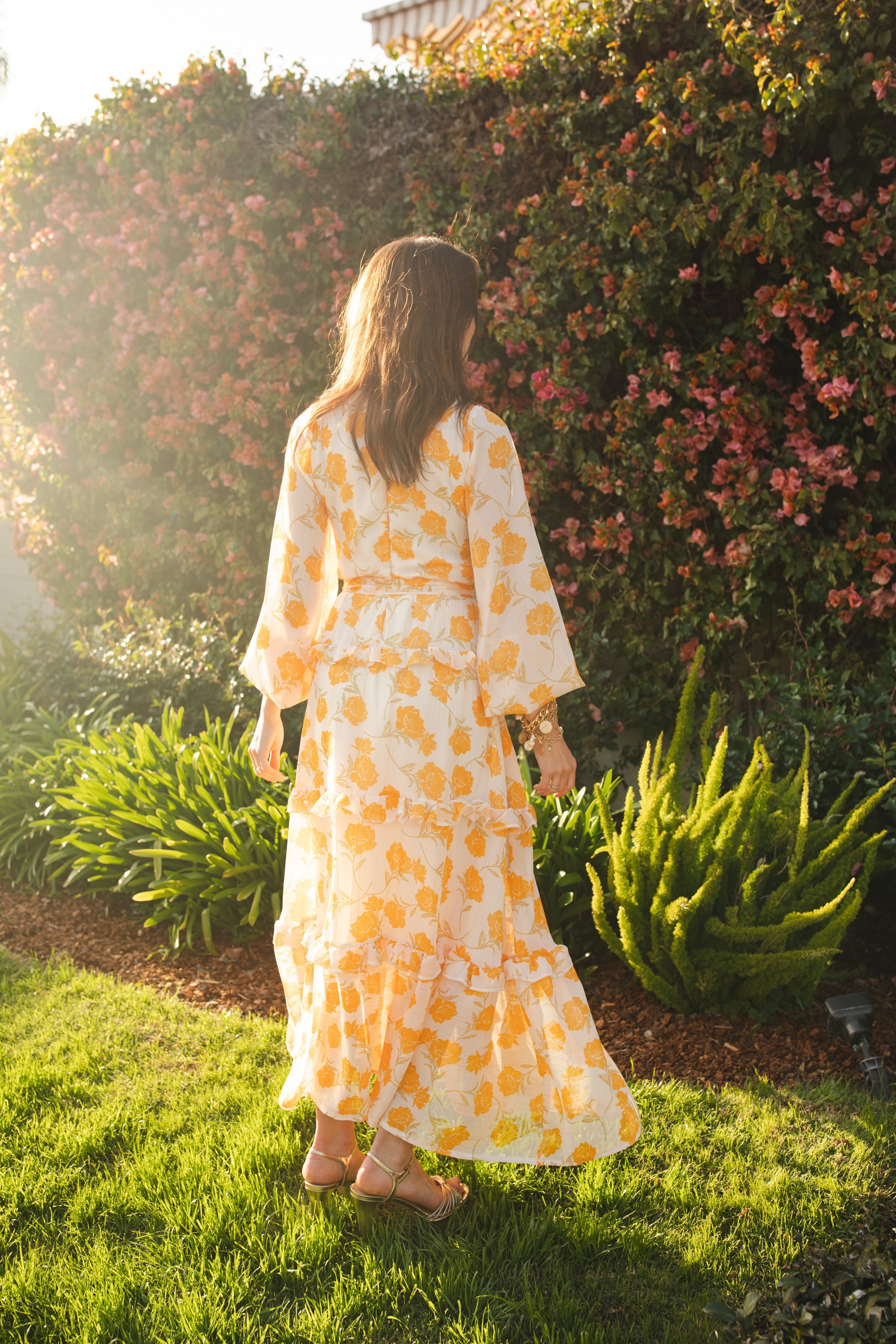 Jennafer Grace Amarillo Love Maxi Dress featuring a flowing yellow fabric and elegant design for summer wear.