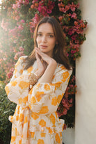 Jennafer Grace Amarillo Love Maxi Dress featuring a flowing yellow fabric and elegant design for summer wear.