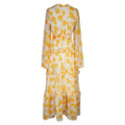 Jennafer Grace Amarillo Love Maxi Dress shown flat, featuring a vibrant yellow color, flowing fabric, and sleeveless design.