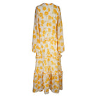 Jennafer Grace Amarillo Love Maxi Dress in yellow, flowing fabric with a sleeveless design and elegant A-line silhouette.