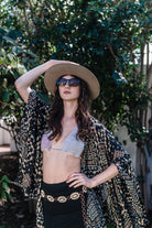 Handmade Antoinette Kimono by Jennafer Grace featuring crochet top design and flowing fabric, displayed on a mannequin.