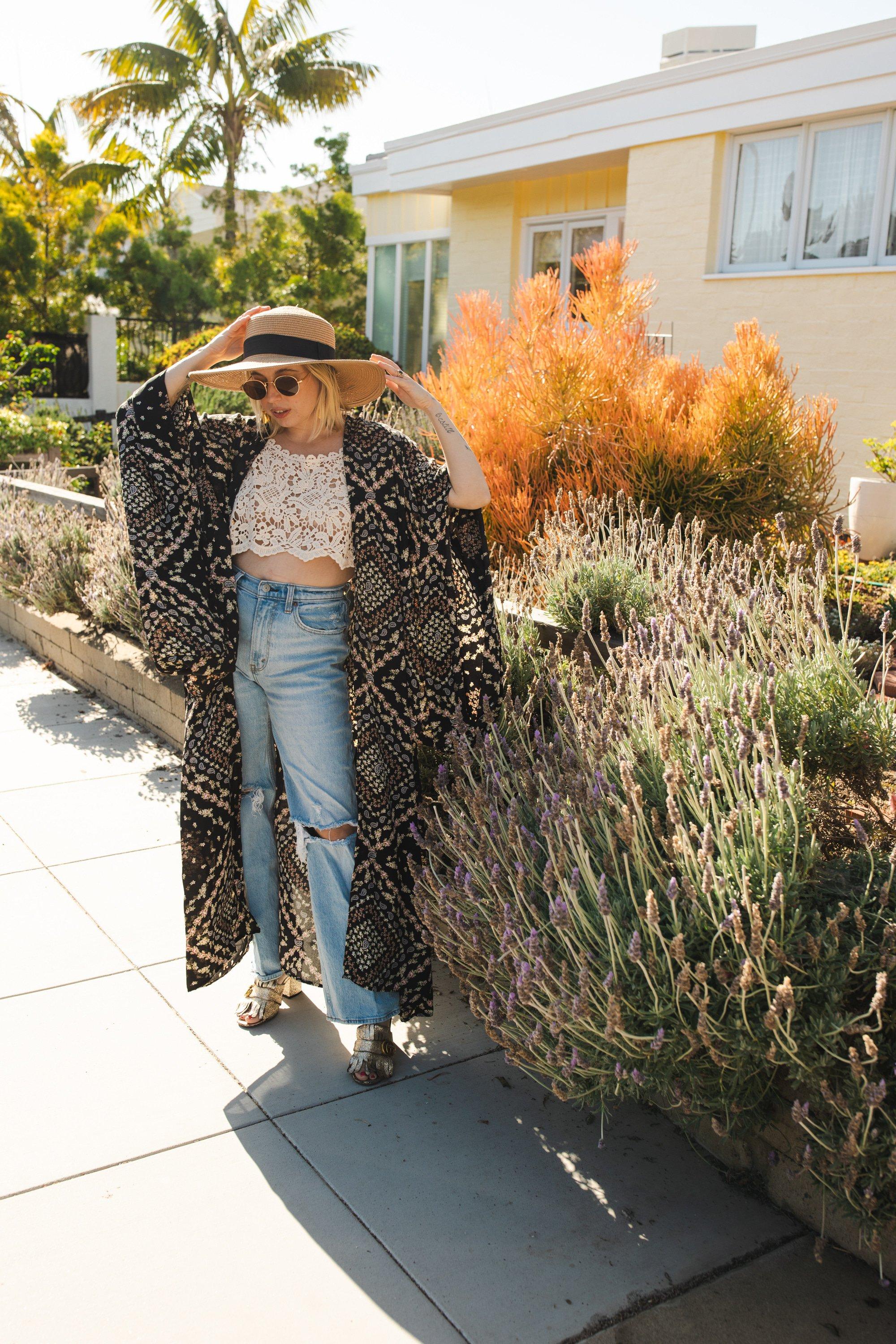 Handmade Antoinette Kimono by Jennafer Grace featuring floral patterns and flowing fabric, displayed on a hanger.