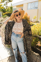 Handmade Antoinette Kimono by Jennafer Grace featuring intricate floral patterns and flowing fabric.