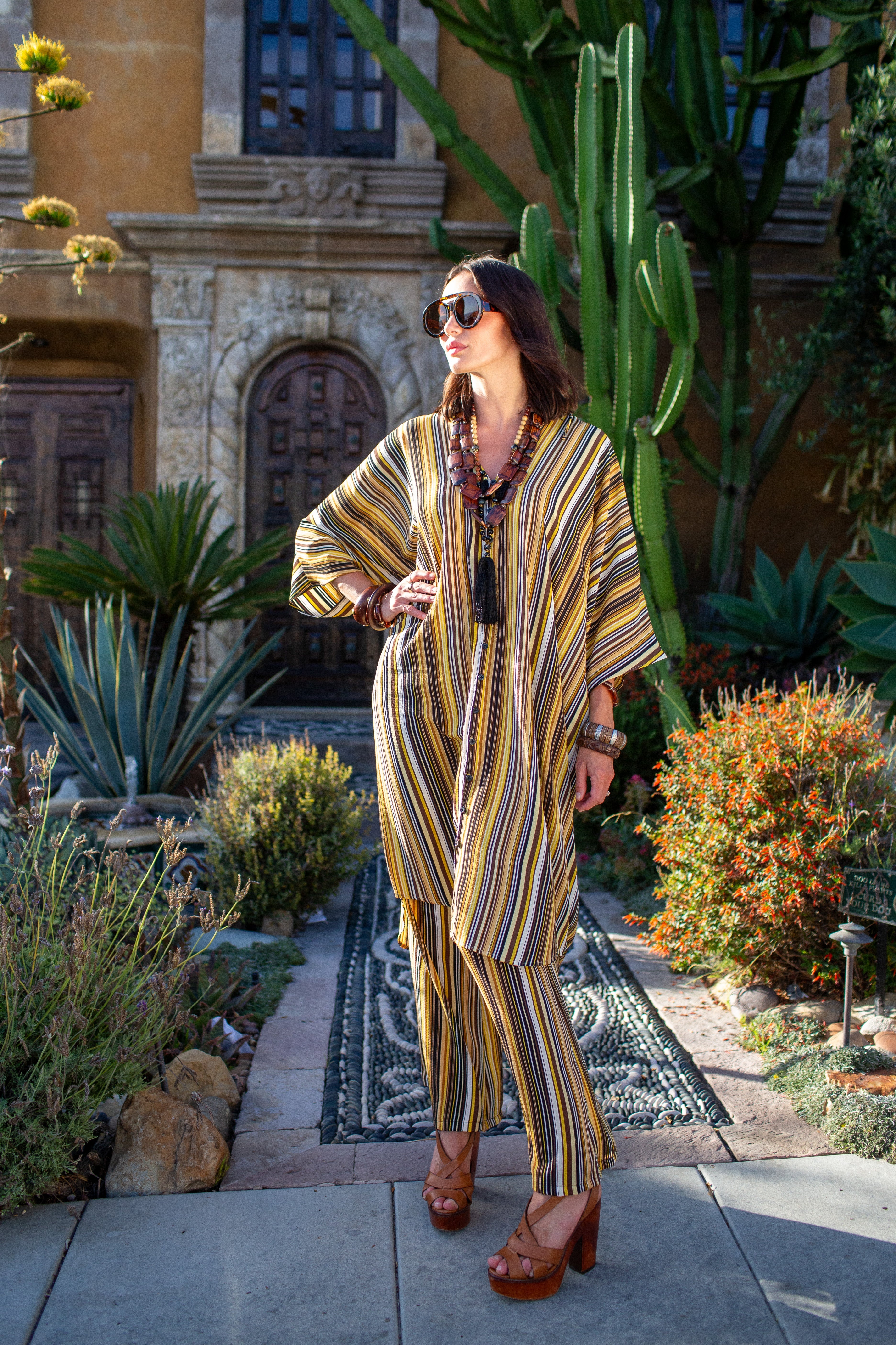 Jennafer Grace bank striped tunic caftan set with matching palazzo pants, featuring relaxed fit and bold stripe pattern.