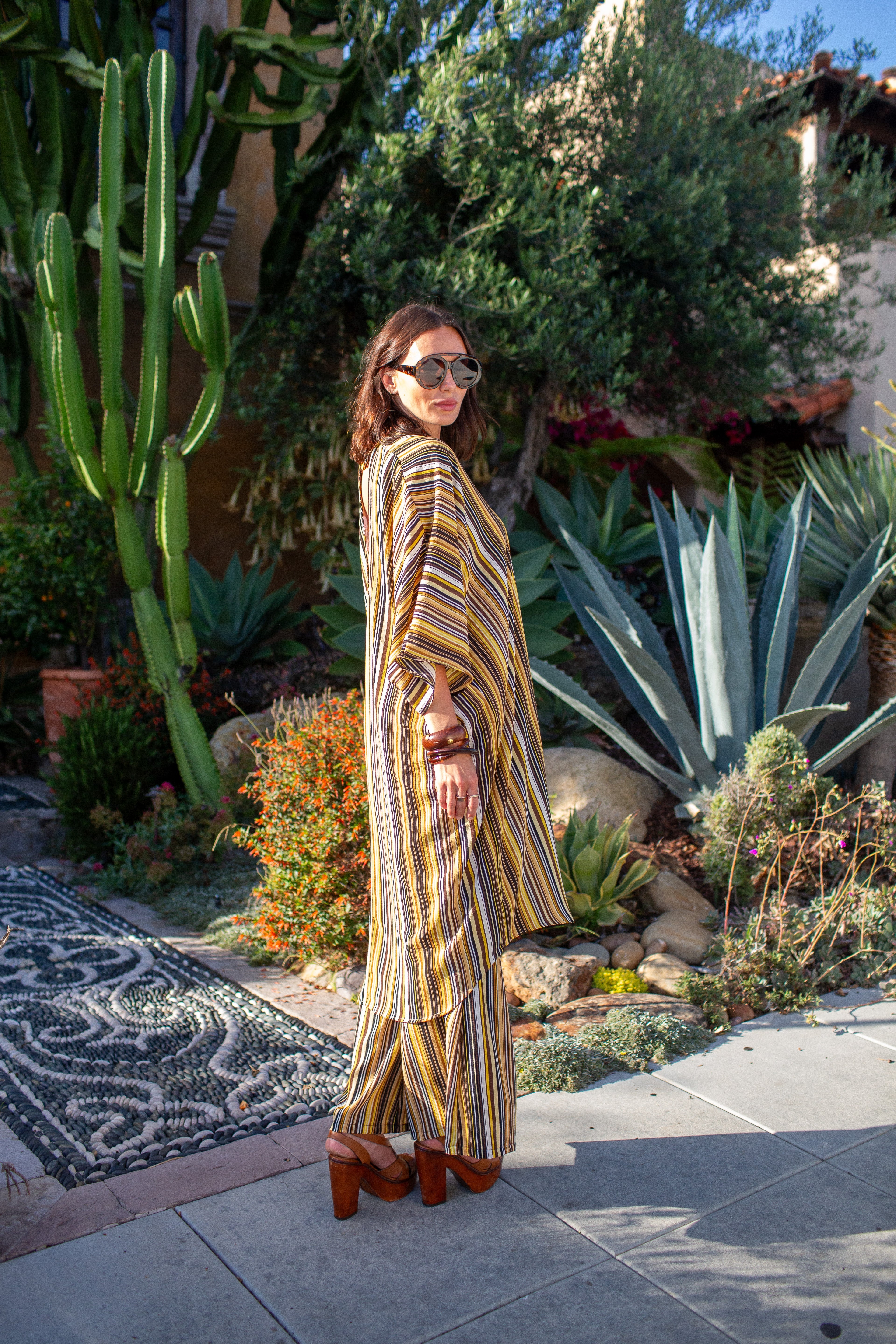 Bank-striped Jennafer Grace tunic caftan set with matching palazzo pants, featuring bold horizontal stripe pattern and relaxed fit.