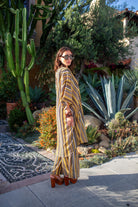 Bank-striped Jennafer Grace tunic caftan set with matching palazzo pants, featuring bold horizontal stripe pattern and relaxed fit.
