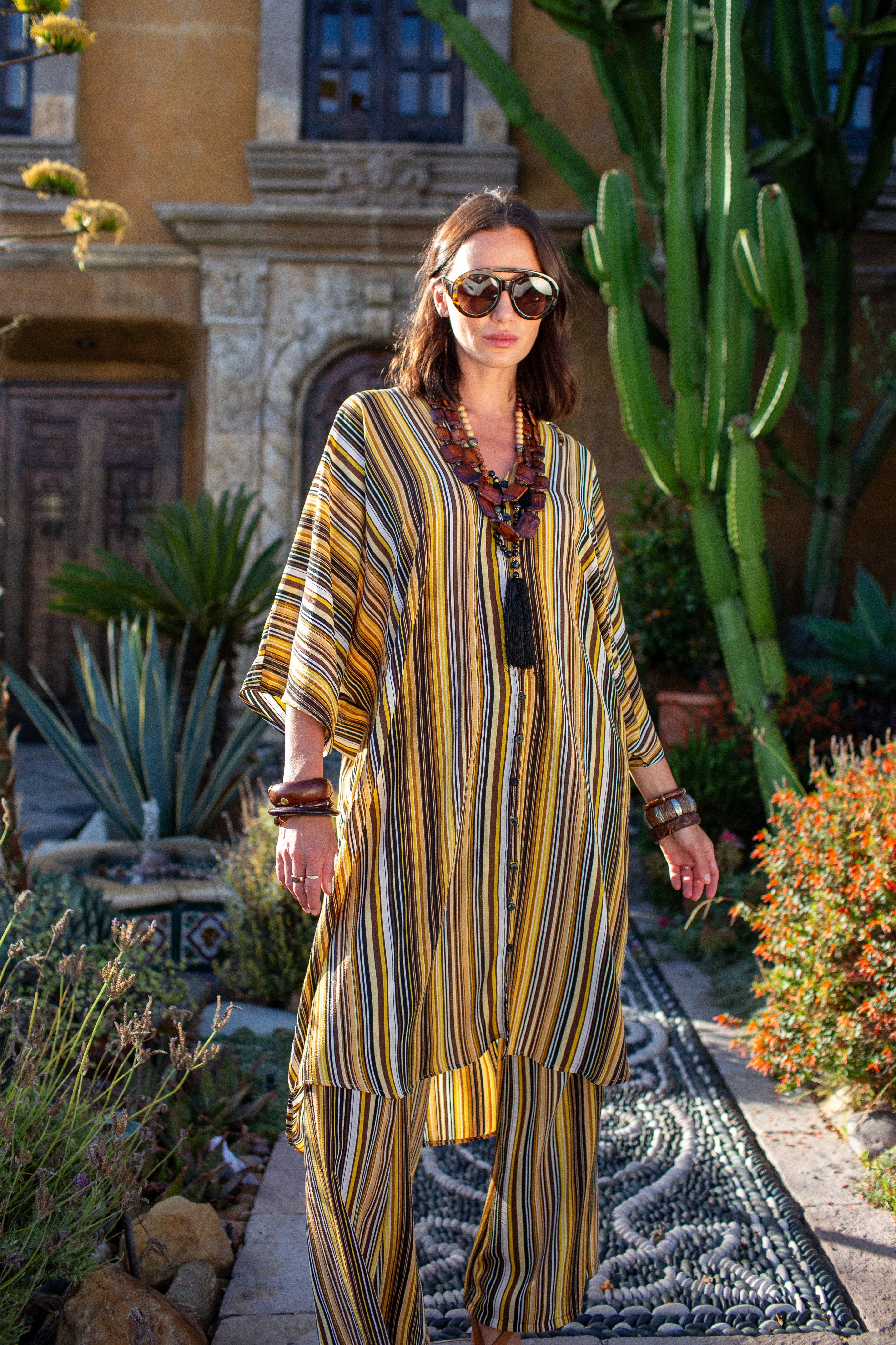 Bank striped tunic and palazzo pant set by Jennafer Grace, featuring a flowy caftan style with bold horizontal stripes.