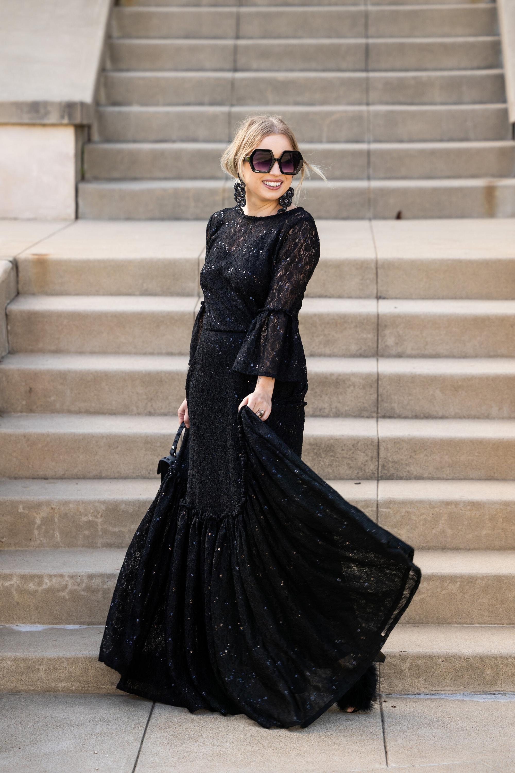 Black sequin lace ruffle dress by Jennafer Grace, featuring intricate lace details and elegant ruffle accents.