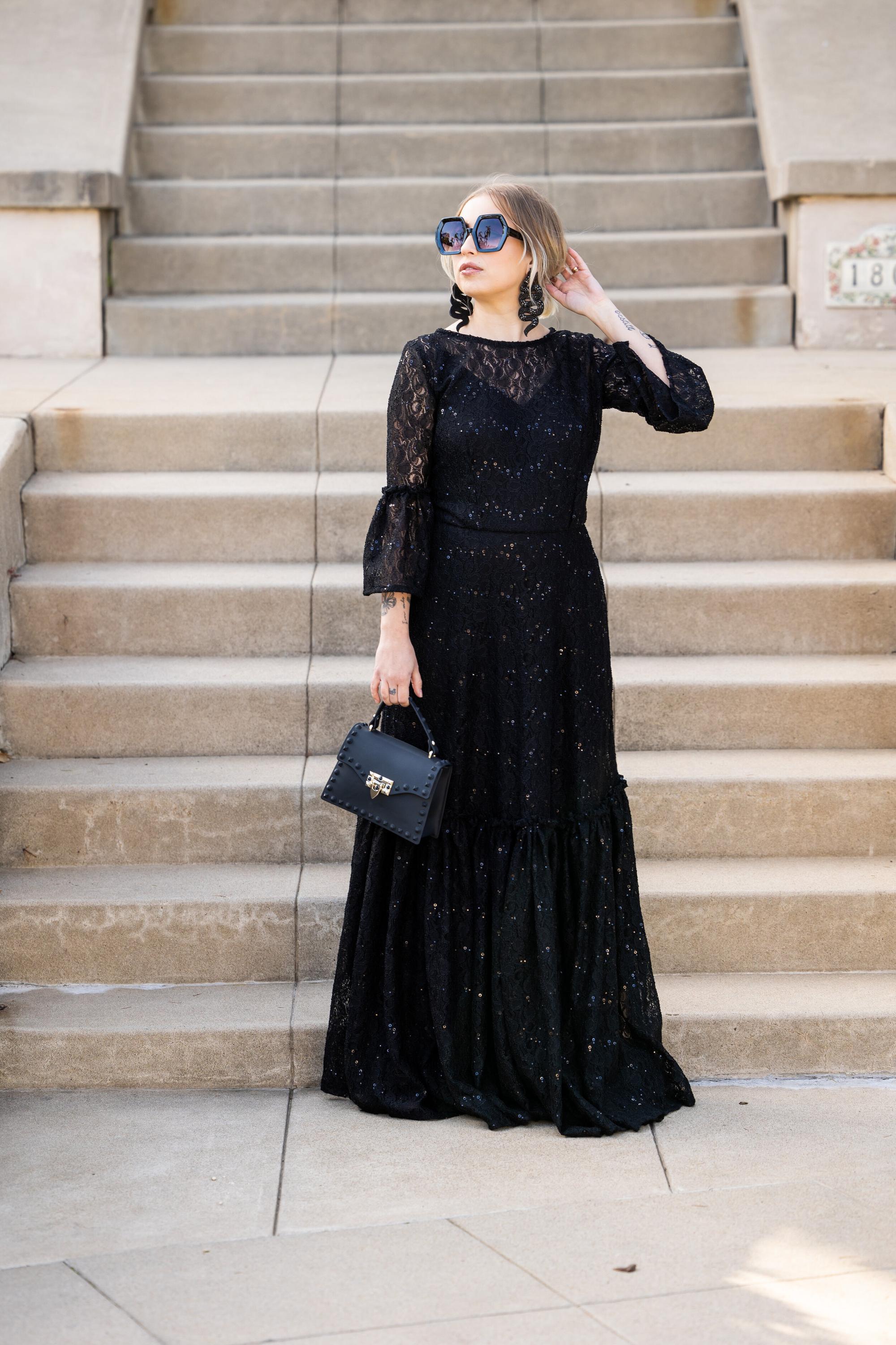 Black sequin lace ruffle dress by Jennafer Grace, featuring intricate lace details and elegant ruffle accents.