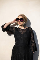 Black sequin lace ruffle dress by Jennafer Grace featuring intricate lace details and elegant ruffles, handmade evening style.