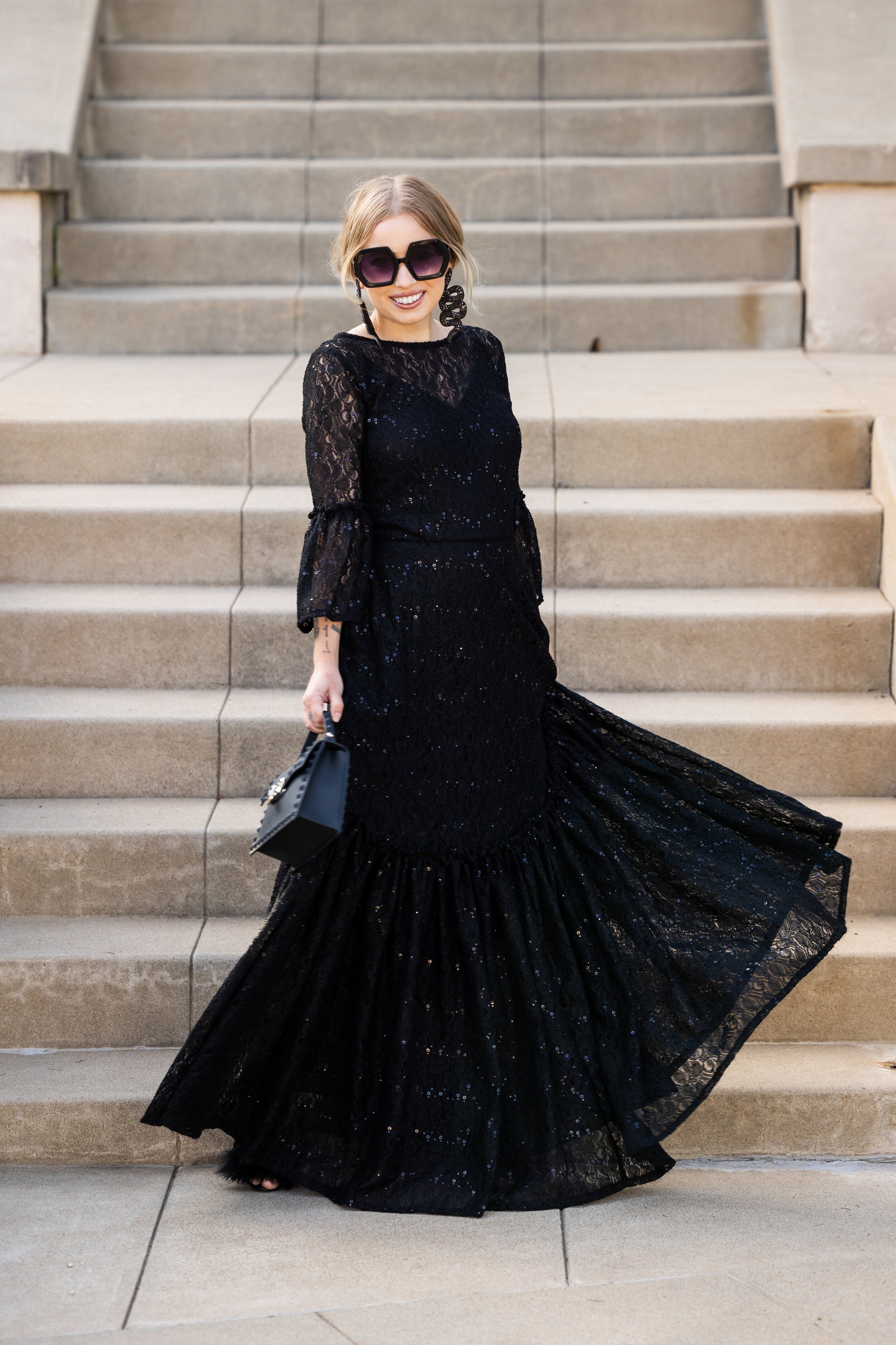 Black sequin lace ruffle dress by Jennafer Grace, featuring intricate lace details and elegant ruffle accents.