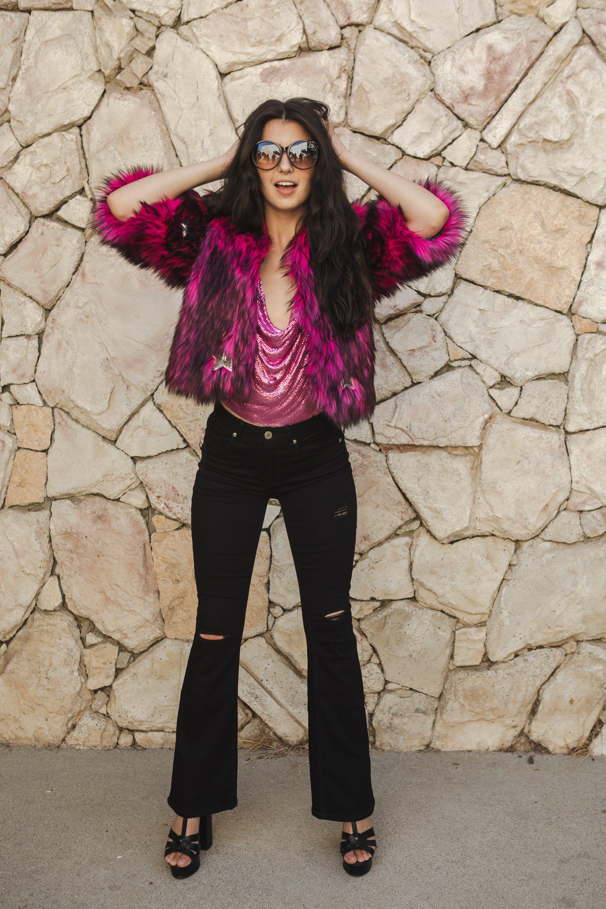 Jennafer Grace Planet Queen faux fur jacket in vibrant monster pink, handmade with plush texture and stylish design.