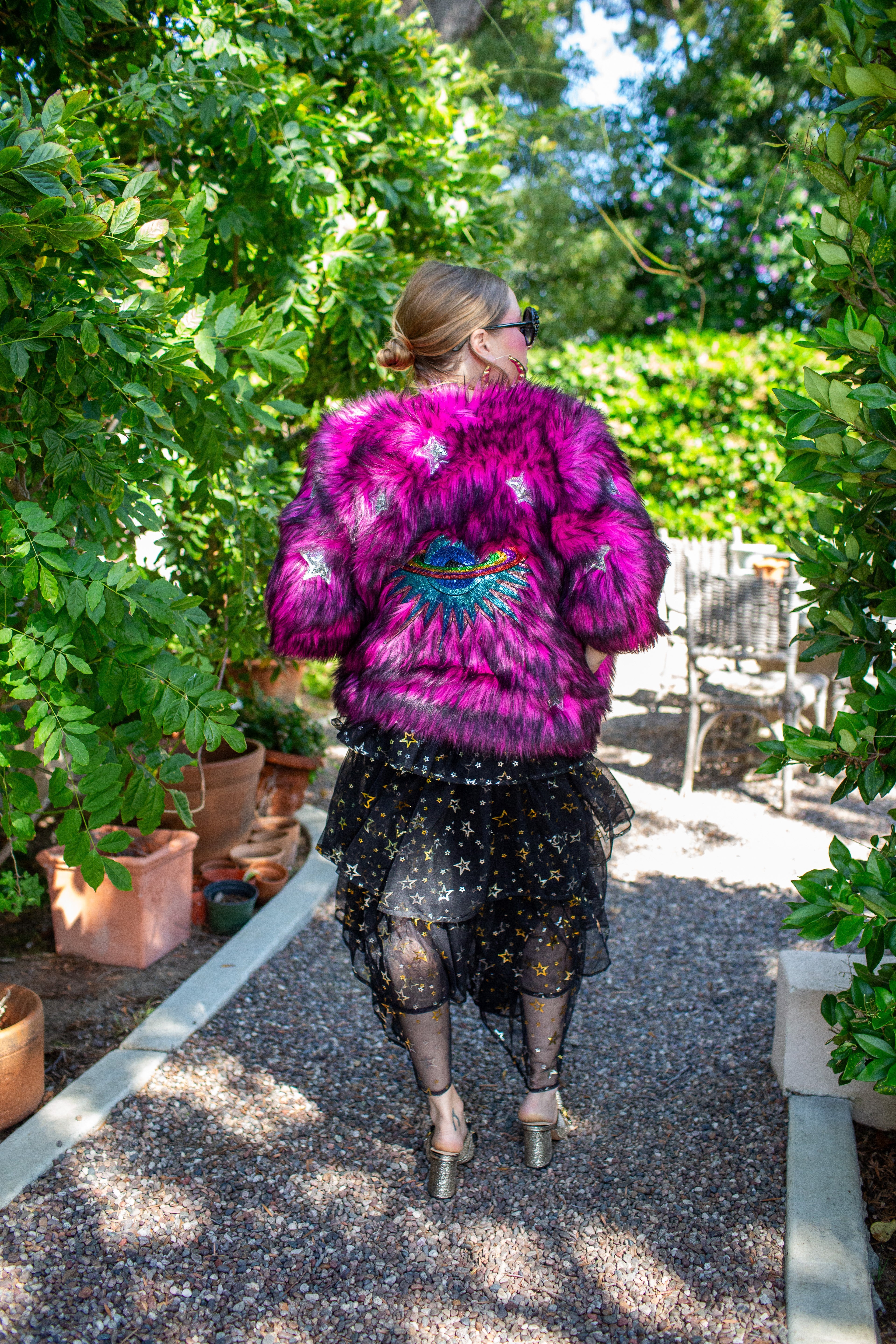 Jennafer Grace Planet Queen faux fur jacket in vibrant monster pink, cozy and stylish outerwear with a plush texture.