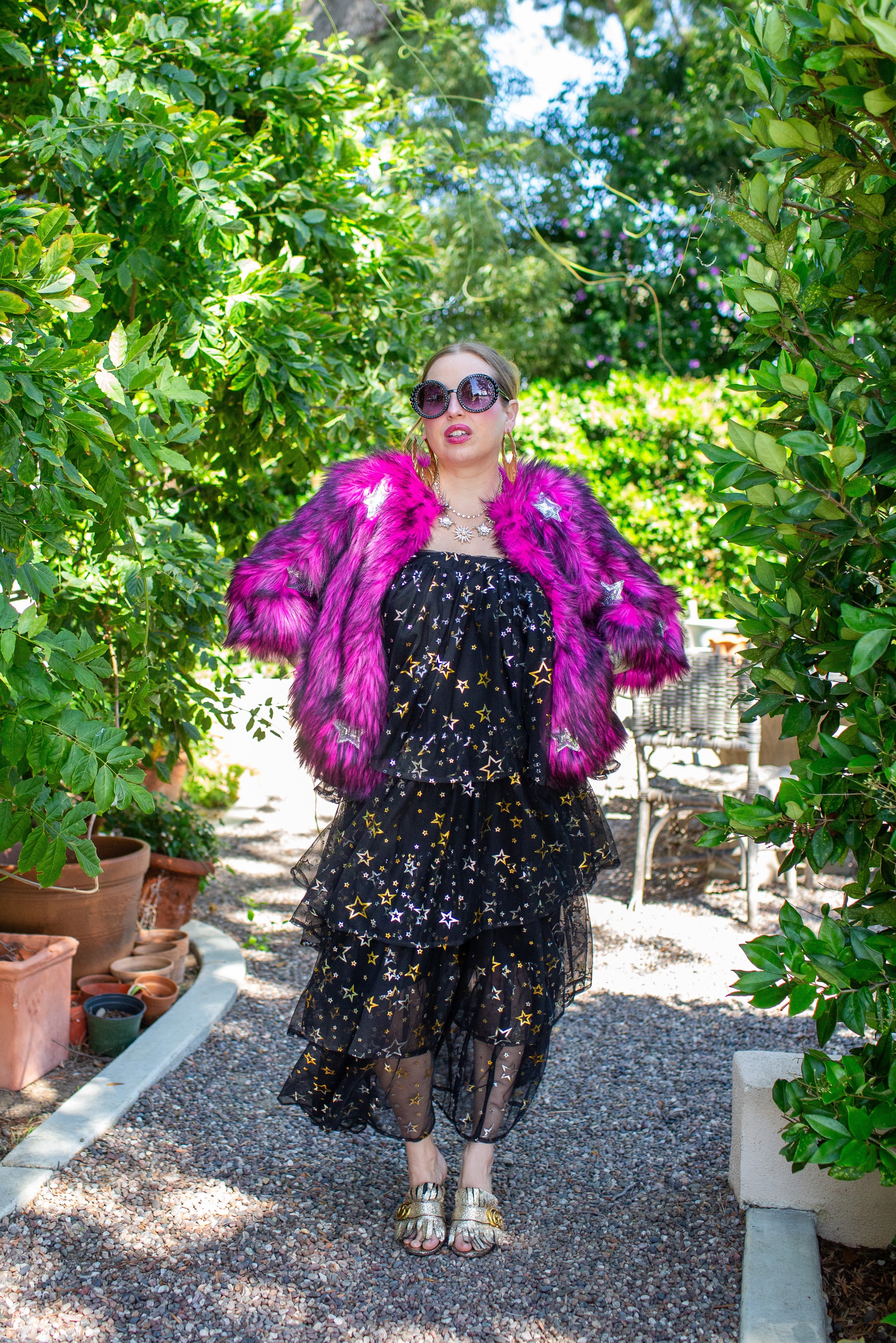 Jennafer Grace Planet Queen faux fur jacket in vibrant monster pink with a cozy, plush texture and stylish fit.