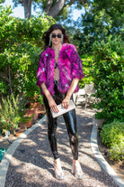 Jennafer Grace Planet Queen faux fur jacket in vibrant monster pink, cozy and stylish for cold weather wear.
