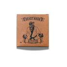 Johnny Slicks After Action Beast Bar soap with natural ingredients, showcasing a rugged, earthy appearance in a close-up shot.
