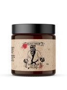 Johnny Slicks After Action Hemp-Free Beast Balm skincare product with a jar of balm showing the label and lid.