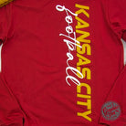 Kansas City Football side print long sleeve graphic tee by The Graphic Tee, featuring team logo and side design on a casual long sleeve shirt.