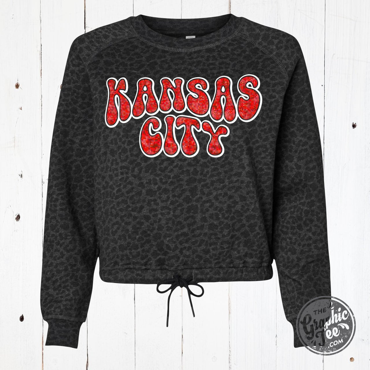 Kansas City Glitter Leopard Crop Sweatshirt by The Graphic Tee, featuring a stylish leopard print and glitter accents.
