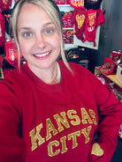 Kansas City Gold Glitter Applique dark red crewneck sweatshirt with graphic design from The Graphic Tee.