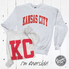Kansas City reversible ash crewneck sweatshirt by The Graphic Tee, showing front and back with Kansas City graphic design.