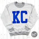 Kansas City Royal Blue Ink reversible crewneck sweatshirt from The Graphic Tee, with sport grey color and graphic design.
