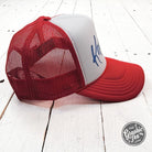 Kansas Red and White Foam Trucker Cap by The Graphic Tee with adjustable snapback and embroidered Kansas logo.