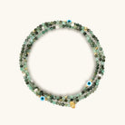 Women's emerald May birthstone wrap bracelet by Karma and Luck featuring a captivating spirit design and adjustable fit.