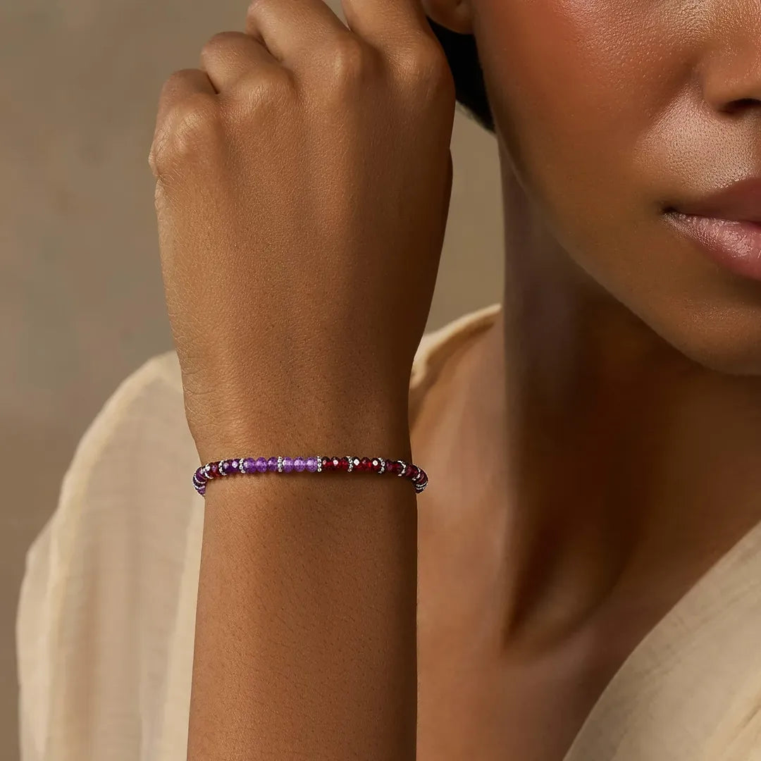 Karma and Luck women's Dreamy Energizer amethyst and garnet drawstring bracelet with beaded design and adjustable closure.
