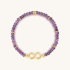 Women's Karma and Luck Eternal Bliss Amethyst Infinity Charm Bracelet featuring purple gemstone beads and infinity charm.