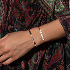 Women's Grounded in Love Evil Eye Tourmaline Hematite bracelet by Karma and Luck, with vibrant beads and protective charm.