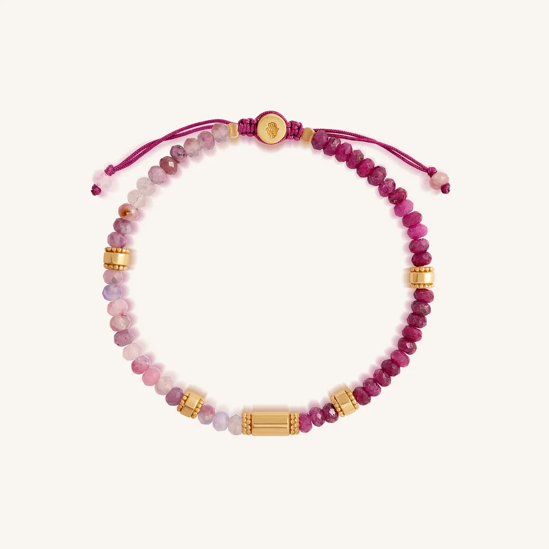 Karma and Luck Heartline Harmony women's bracelet with ruby and pink tourmaline stones and adjustable drawstring closure.