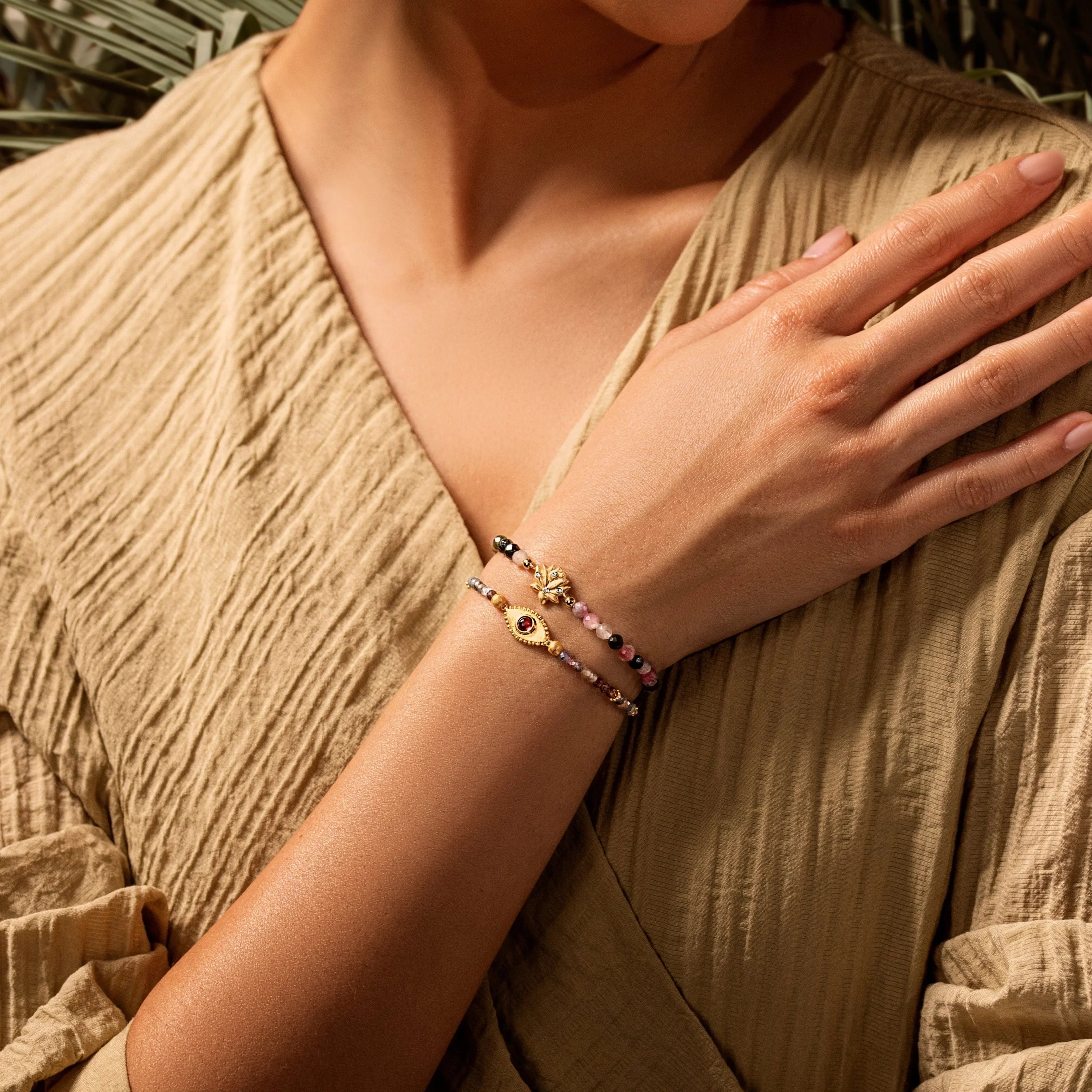Gold plated Lotus Blossom bracelet with tourmaline stones, designed for women by Karma and Luck, featuring intricate floral details.