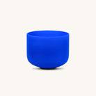 Blue throat chakra singing bowl from Karma and Luck, used as home decor, featuring intricate designs and a polished finish.
