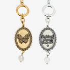 Katia Designs antique gold butterfly choker necklace with engraved "She Believed She Could" lettering, stylish and elegant jewelry.