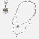 Dainty antique gold necklace with black lip pearl and I Am Enough heart pendant by Katia Designs.