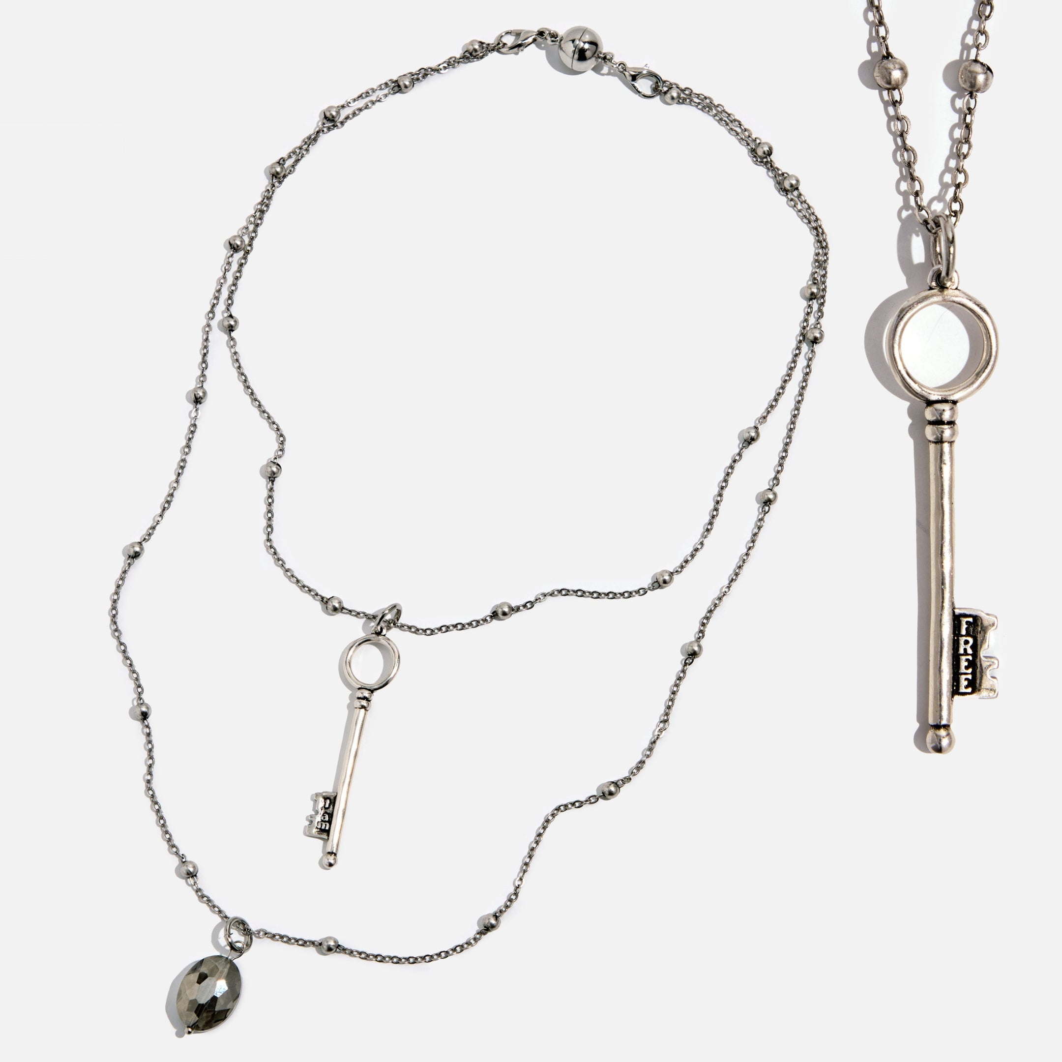 Katia Designs dainty antique gold "I Am Free" key necklace with delicate chain and small key pendant.
