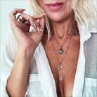 Dainty antique gold Katia Designs "I Am Free" key necklace with delicate chain and intricate key pendant.