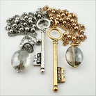 Katia Designs dainty antique gold "I Am Free" key necklace, delicate jewelry with intricate key pendant on a fine chain.