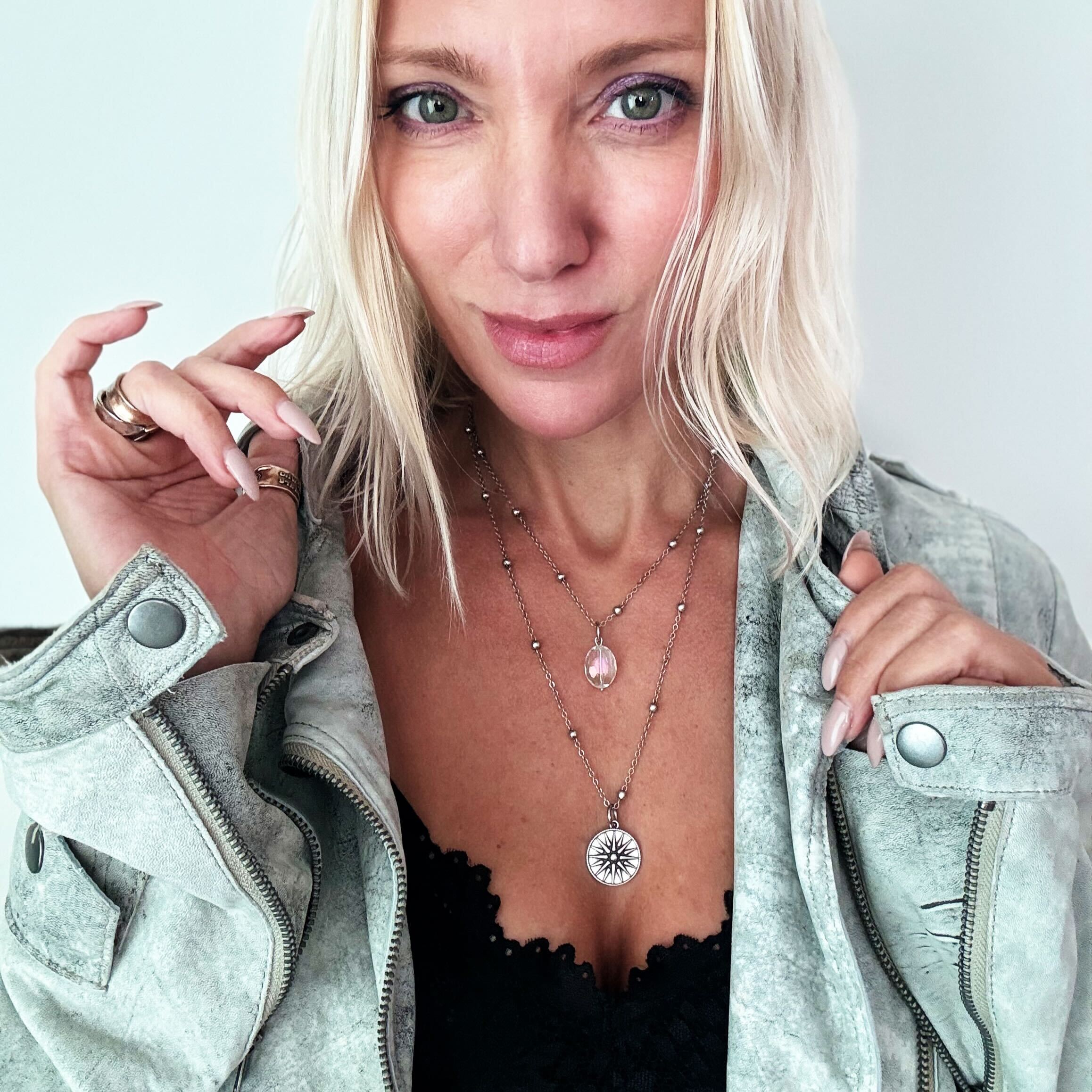 Silver dainty "This Too Shall Pass" star necklace by Katia Designs, featuring a delicate chain and star pendant.
