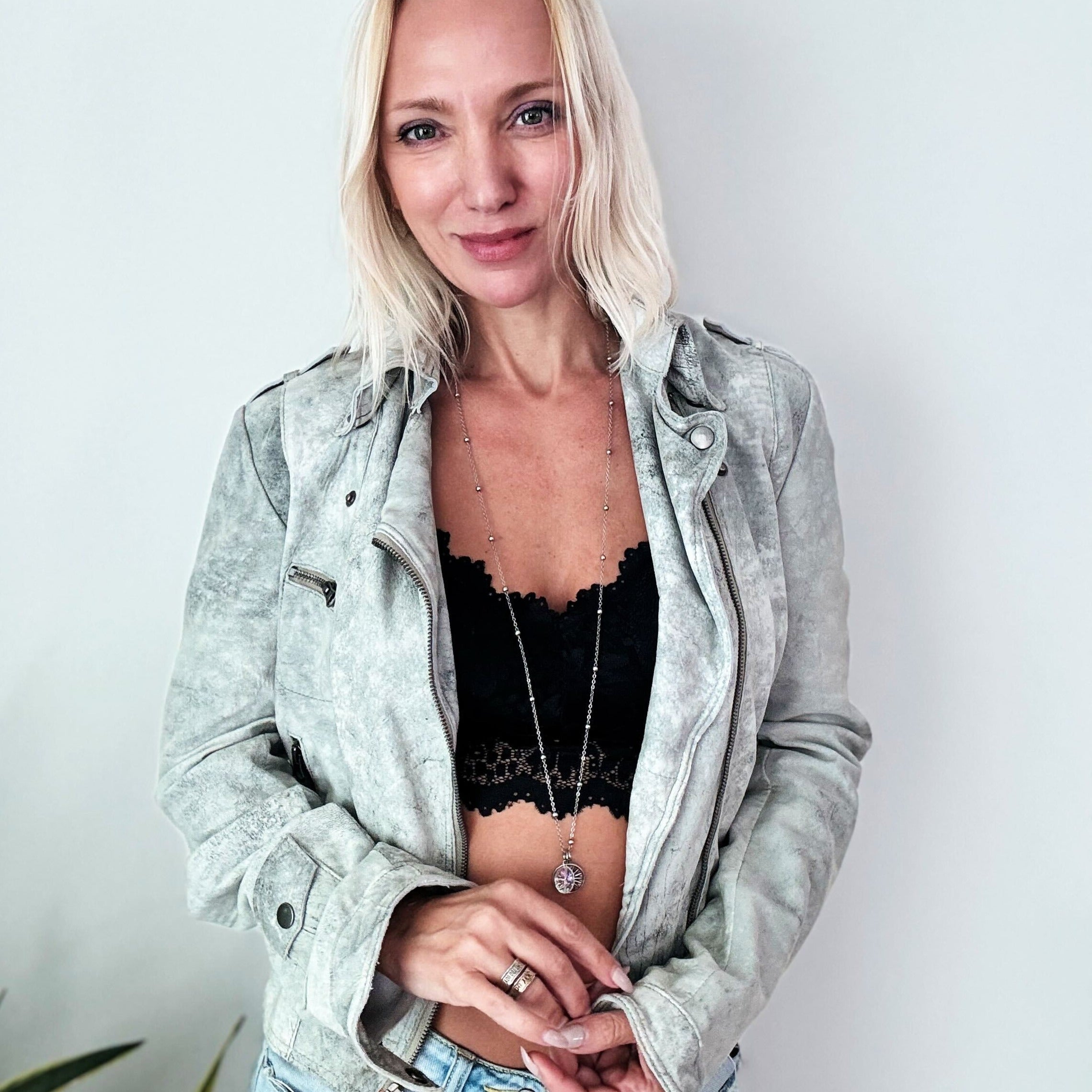 Dainty silver necklace by Katia Designs featuring a star pendant and the phrase "This Too Shall Pass."