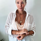 Katia Designs Follow Your Heart Heart Locket Essential Necklace in antique gold, featuring a delicate heart-shaped pendant.