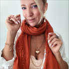 Katia Designs antique gold Follow Your Heart Heart Locket Essential Necklace with intricate heart-shaped pendant.