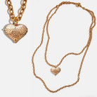 Katia Designs antique gold heart locket essential necklace featuring a delicate heart pendant on a fine chain.