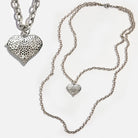 Katia Designs Follow Your Heart Heart Locket Essential Necklace in antique gold, featuring a delicate heart-shaped pendant.