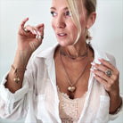 Katia Designs Follow Your Heart Heart Locket Essential Necklace in antique gold, featuring a delicate heart-shaped pendant.