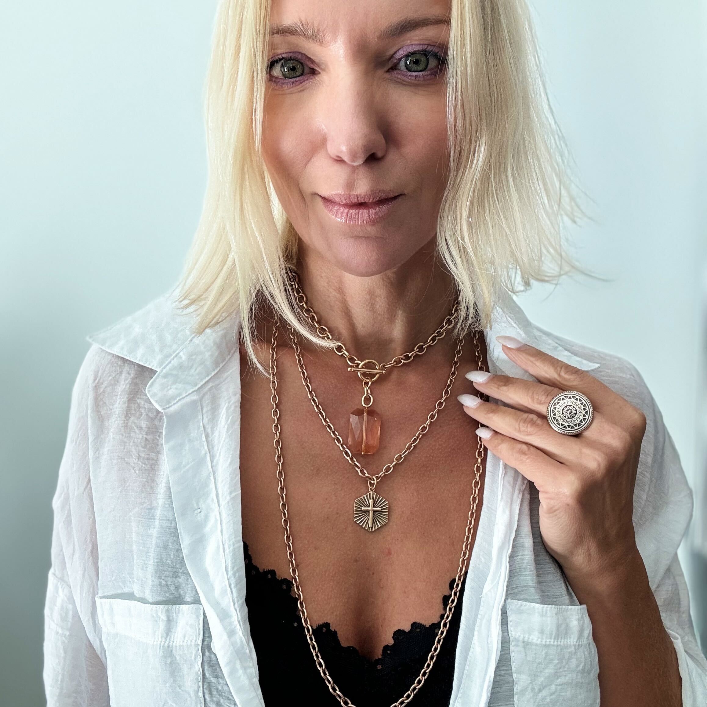 Antique gold Have Faith essential necklace by Katia Designs featuring a delicate pendant on a fine chain.