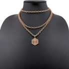 Antique gold Have Faith essential necklace by Katia Designs featuring a simple pendant on a delicate chain.