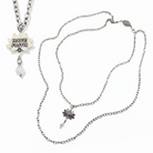 Katia Designs antique gold Have Faith essential necklace with a delicate pendant and chain, showcasing elegant jewelry craftsmanship.
