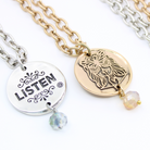 Katia Designs Listen Madame Butterfly Essential Necklace in antique gold, featuring delicate butterfly pendant on a fine chain.